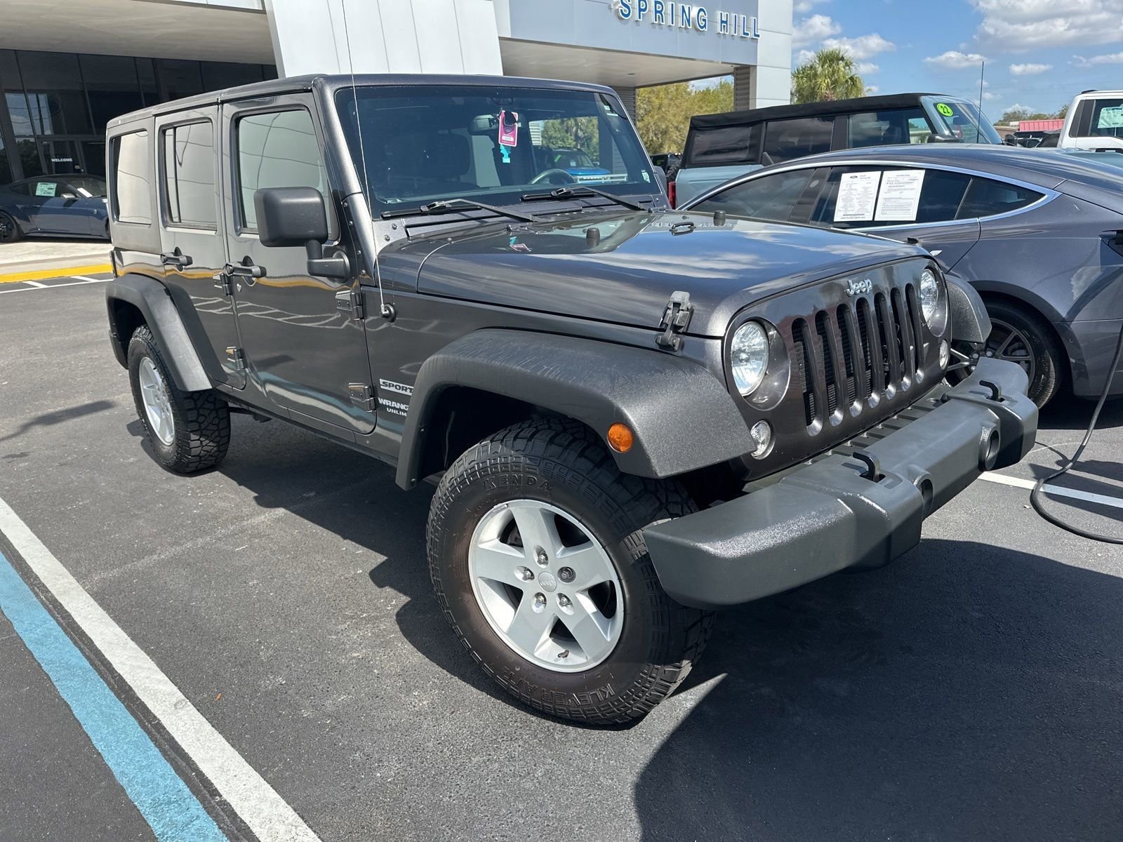 Used 2017 Jeep Wrangler Unlimited Sport S with VIN 1C4BJWDG8HL504130 for sale in Spring Hill, FL