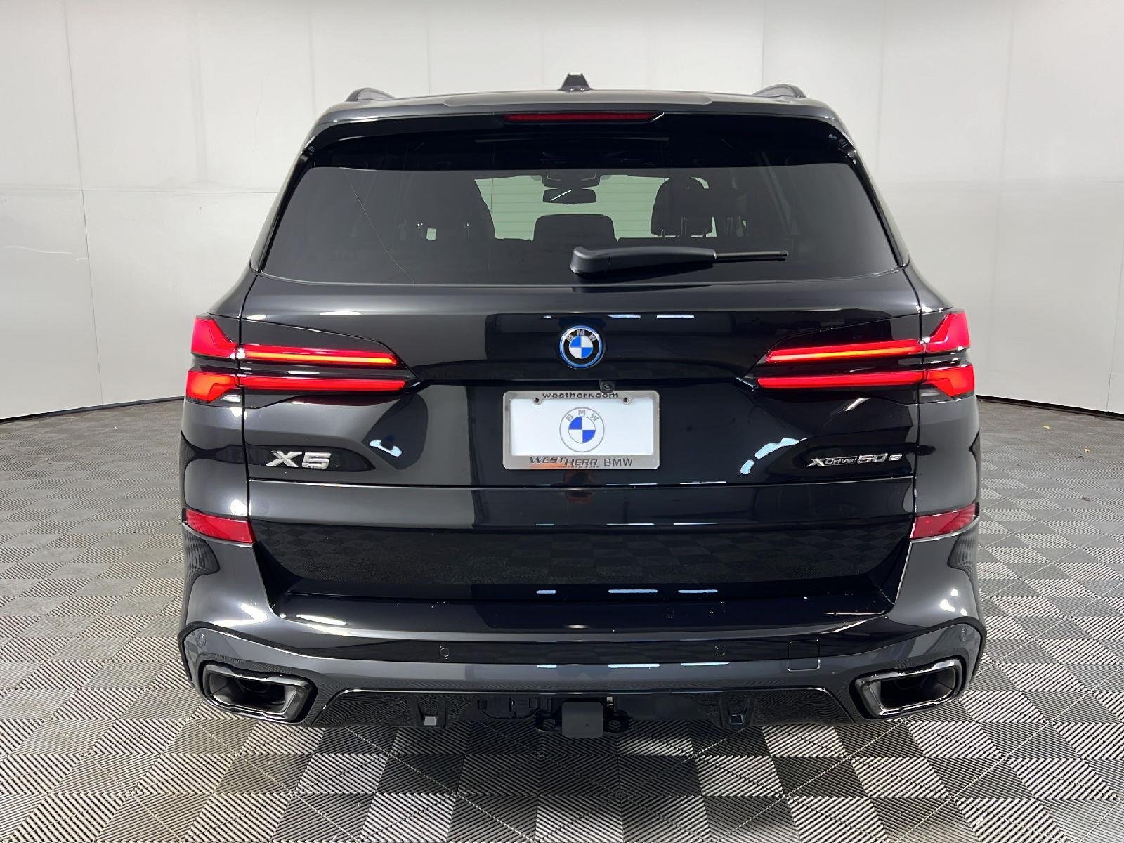 New 2026 Black Sapphire Metallic BMW xDrive50e image 4