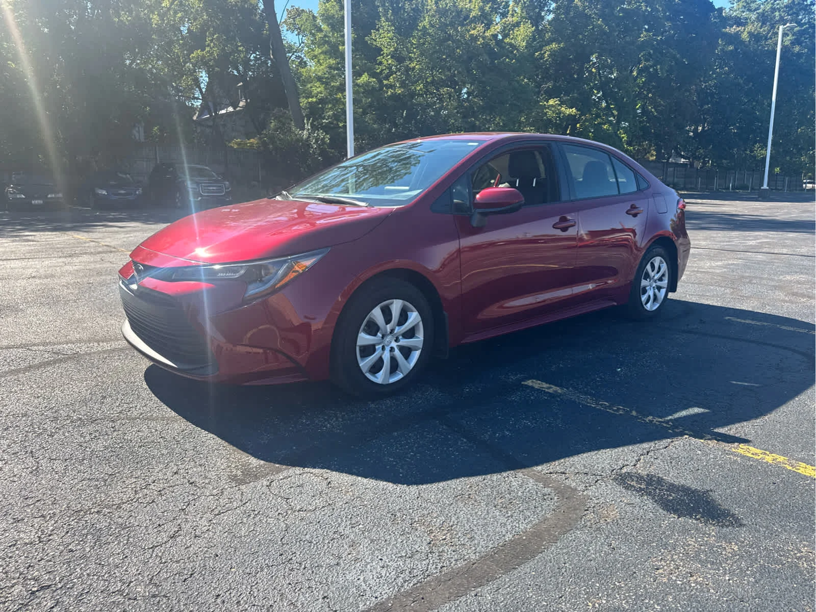 Used 2024 Ruby Flare Pearl Toyota LE image 4