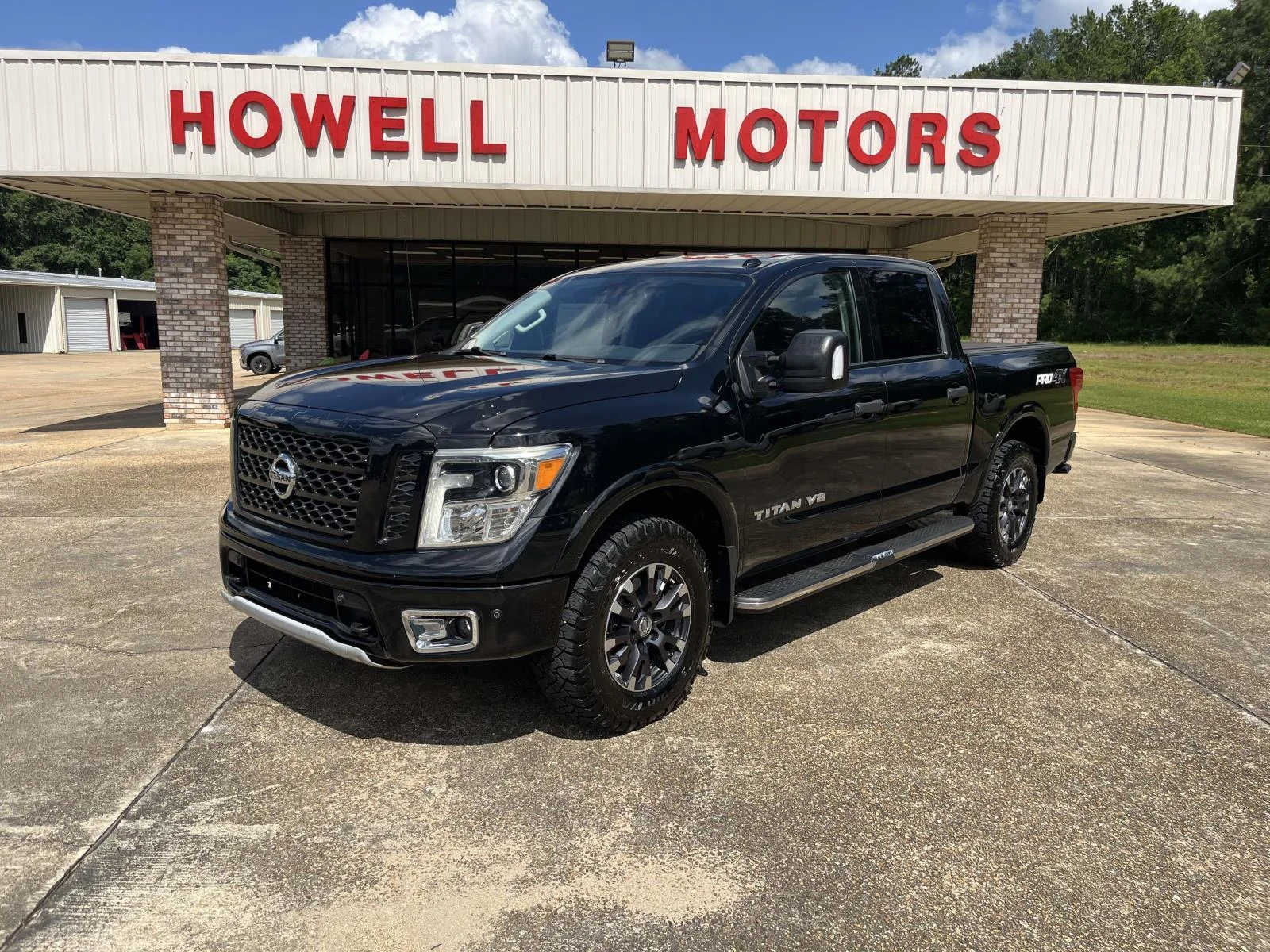 Used 2018 Magnetic Black Nissan 4x4 Crew Cab PRO-4X image 1