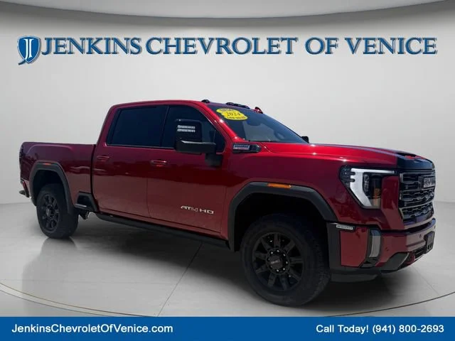 Used 2024 Volcanic Red Tintcoat GMC AT4 image 1