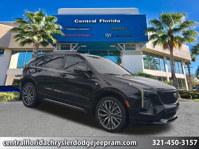 Used 2024 Black Cadillac Sport image 1