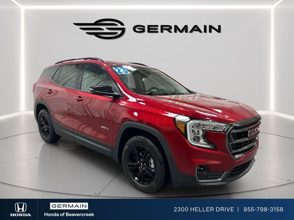 Used 2023 Volcanic Red Tintcoat GMC AT4 image 1