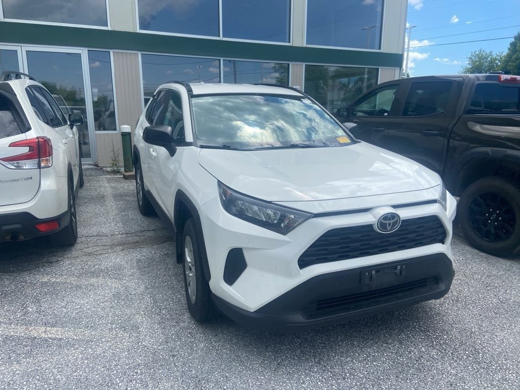 Used 2021 Super White Toyota LE image 1