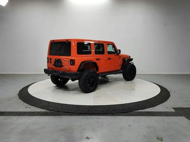 Used 2018 Orange Jeep Unlimited Sahara image 7
