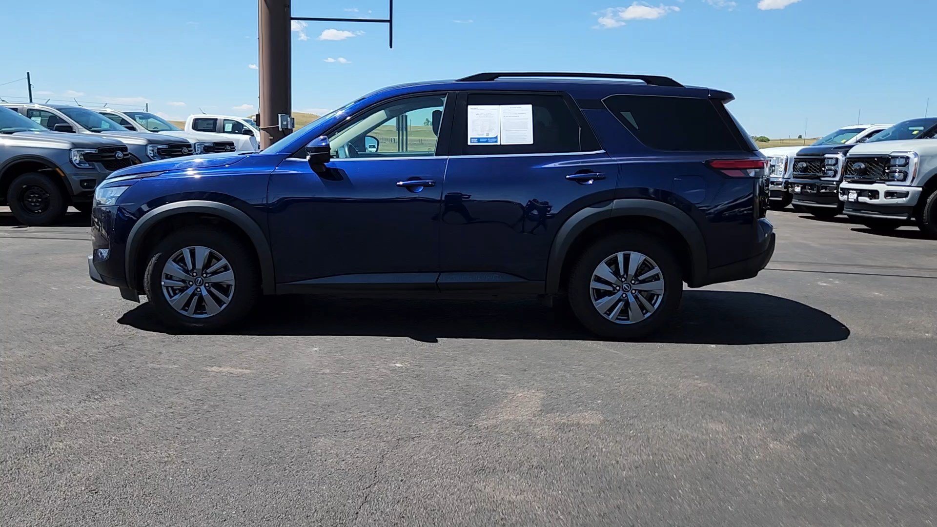 Used 2025 Deep Ocean Blue Pearl Nissan SV image 2