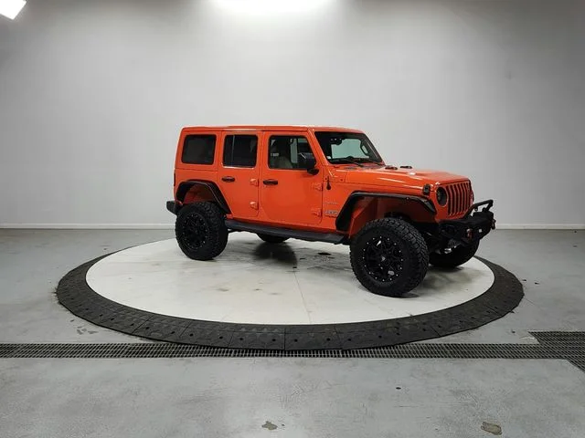 Used 2018 Orange Jeep Unlimited Sahara image 1