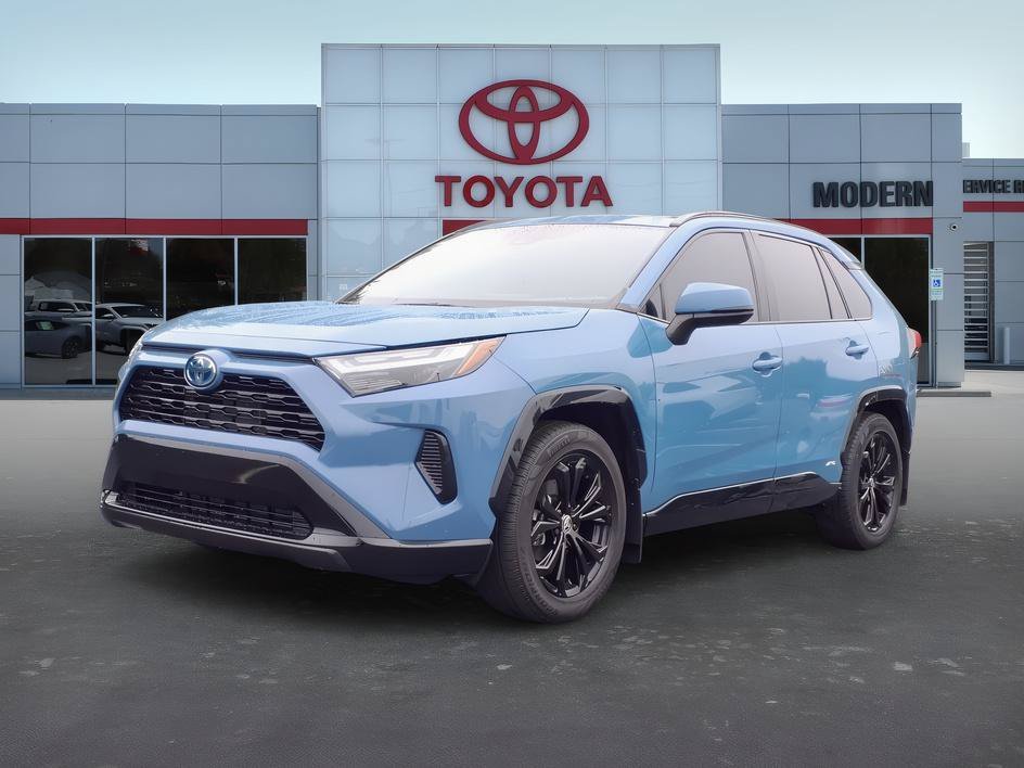 Used 2022 Cavalry Blue Toyota Hybrid SE image 1