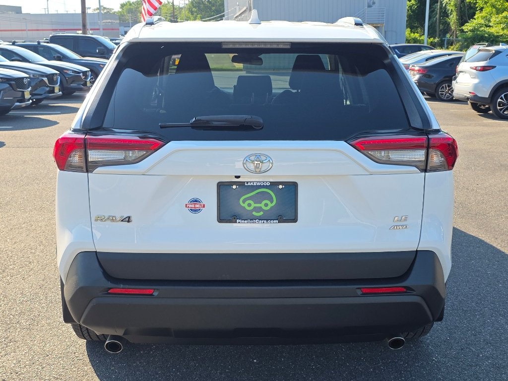 Used 2021 Super White Toyota LE image 12