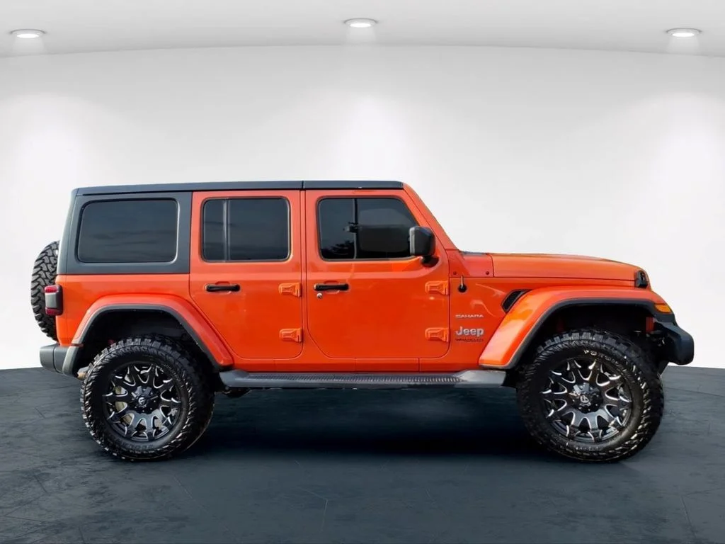 Used 2018 Orange Jeep Unlimited Sahara image 5