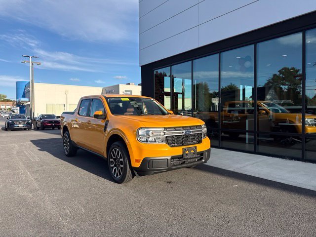 Used 2022 Orange Ford Lariat image 1