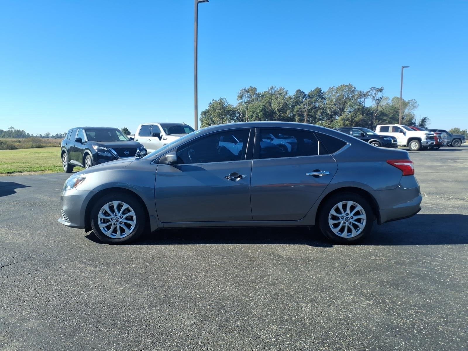 Used 2016 Gun Metallic Nissan SV image 2