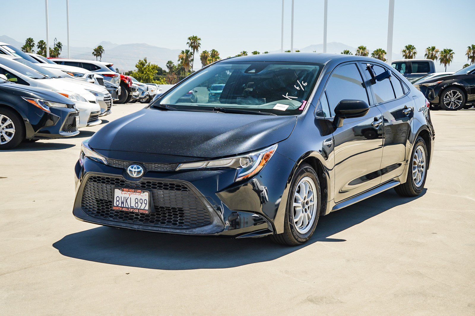 Used 2021 Black Sand Pearl Toyota Hybrid LE image 3