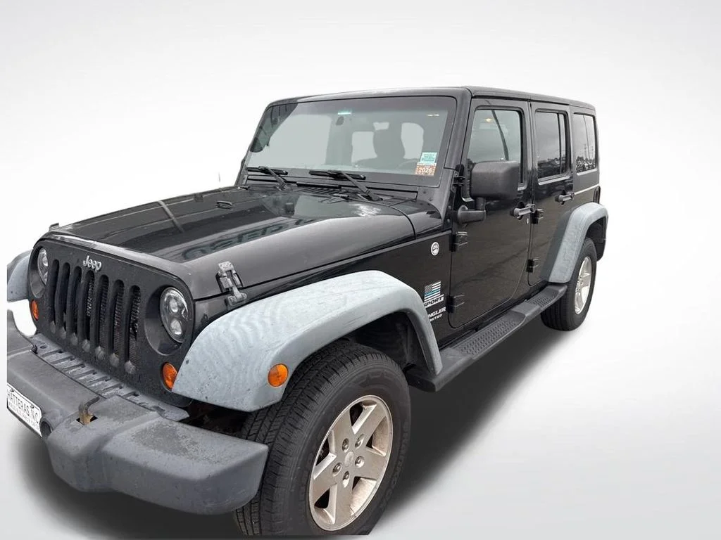 Used 2012 Black Jeep Unlimited Sport image 9