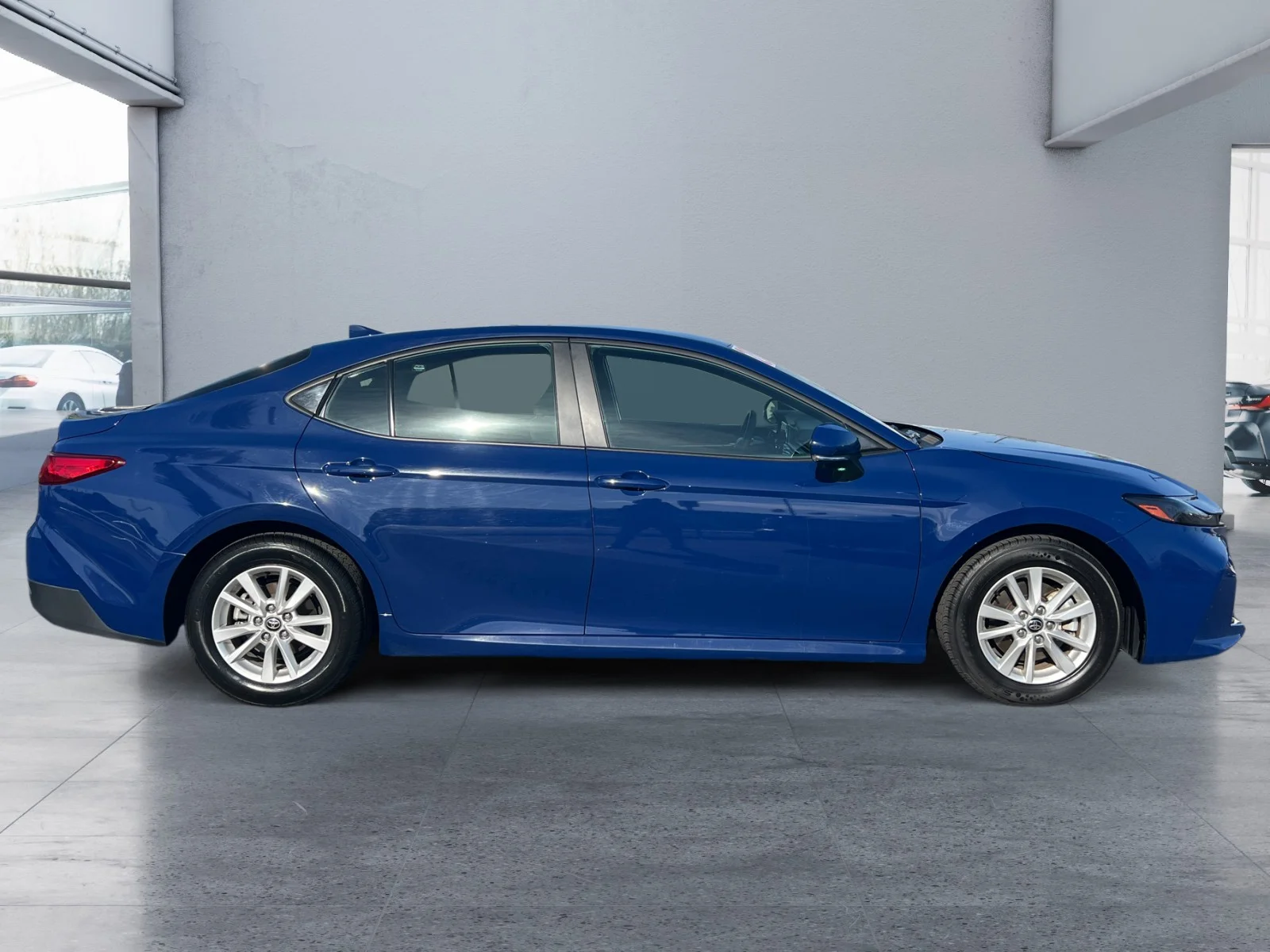 Used 2025 Reservoir Blue Toyota LE image 6