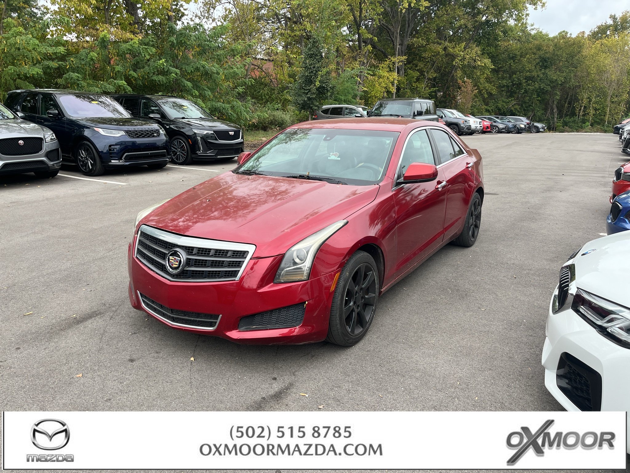 Used 2014 Red Obsession Tintcoat Cadillac Standard AWD image 1