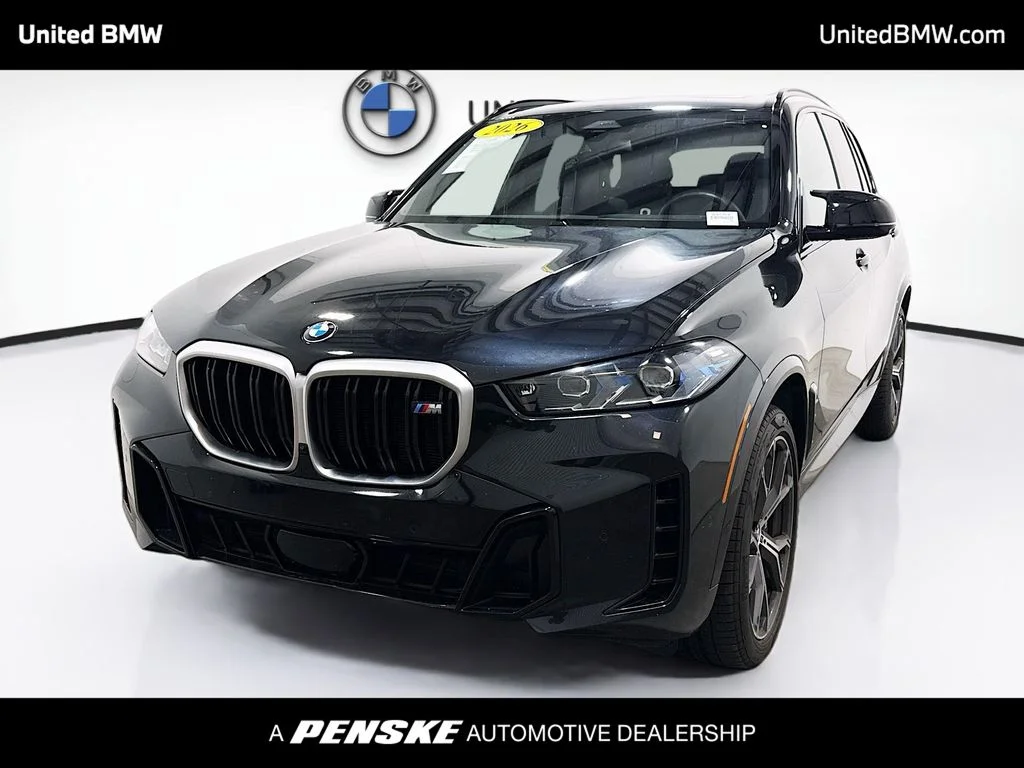 Certified Used 2026 Black Sapphire Metallic BMW M60i image 1