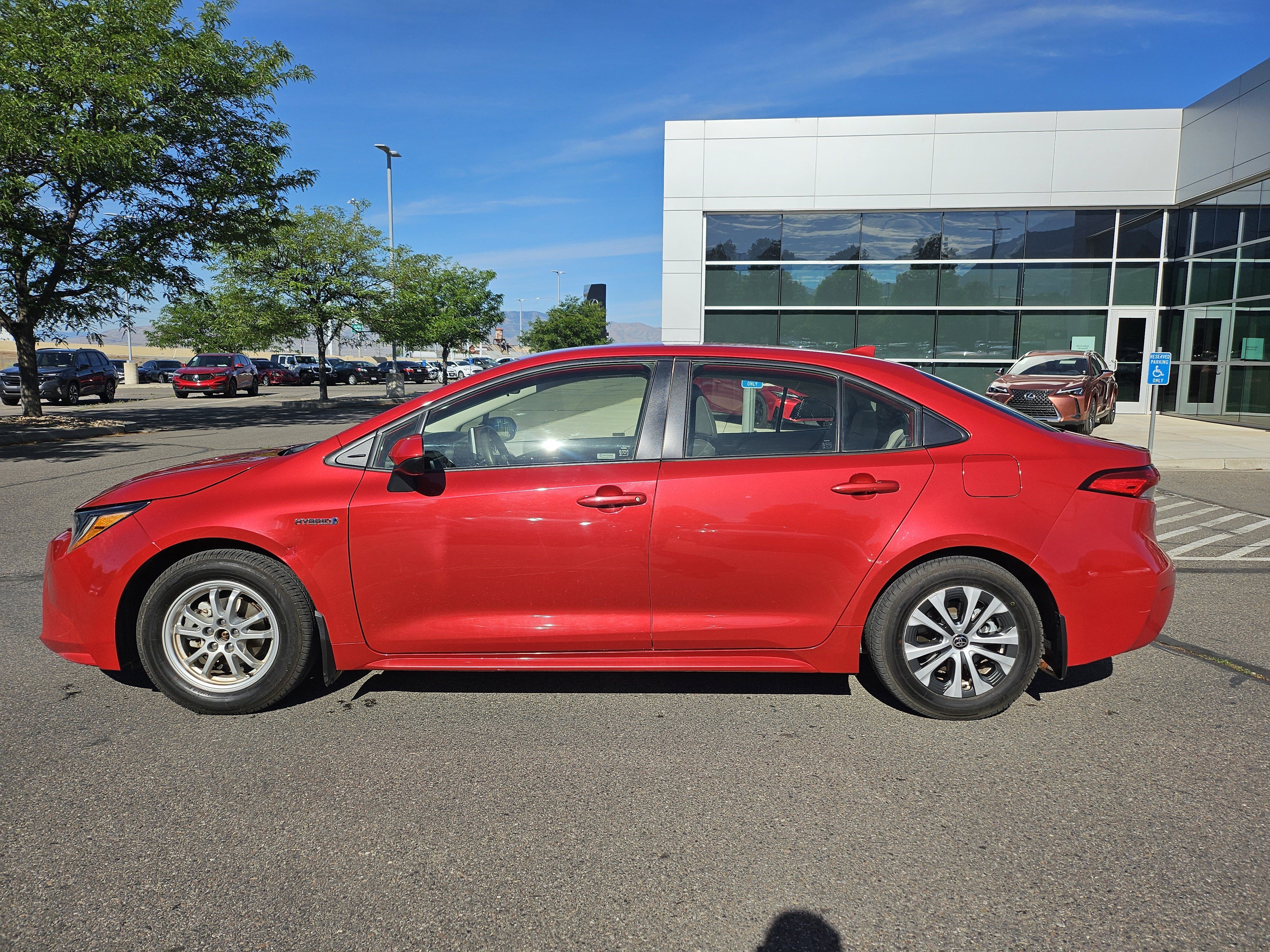 Used 2021 Barcelona Red Metallic Toyota LE image 9