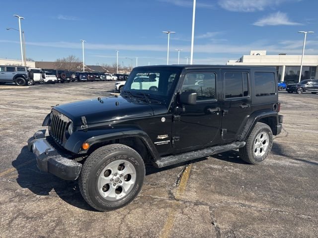 Used 2014 Jeep Wrangler Unlimited Sahara with VIN 1C4BJWEG6EL121104 for sale in Bloomington, IL