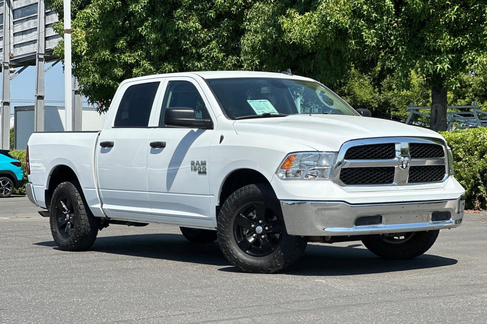 Used 2023 Bright White Clearcoat Ram SLT image 1