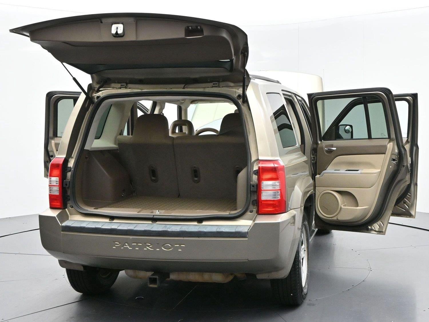 Used 2008 Light Khaki Metallic Jeep Sport image 36