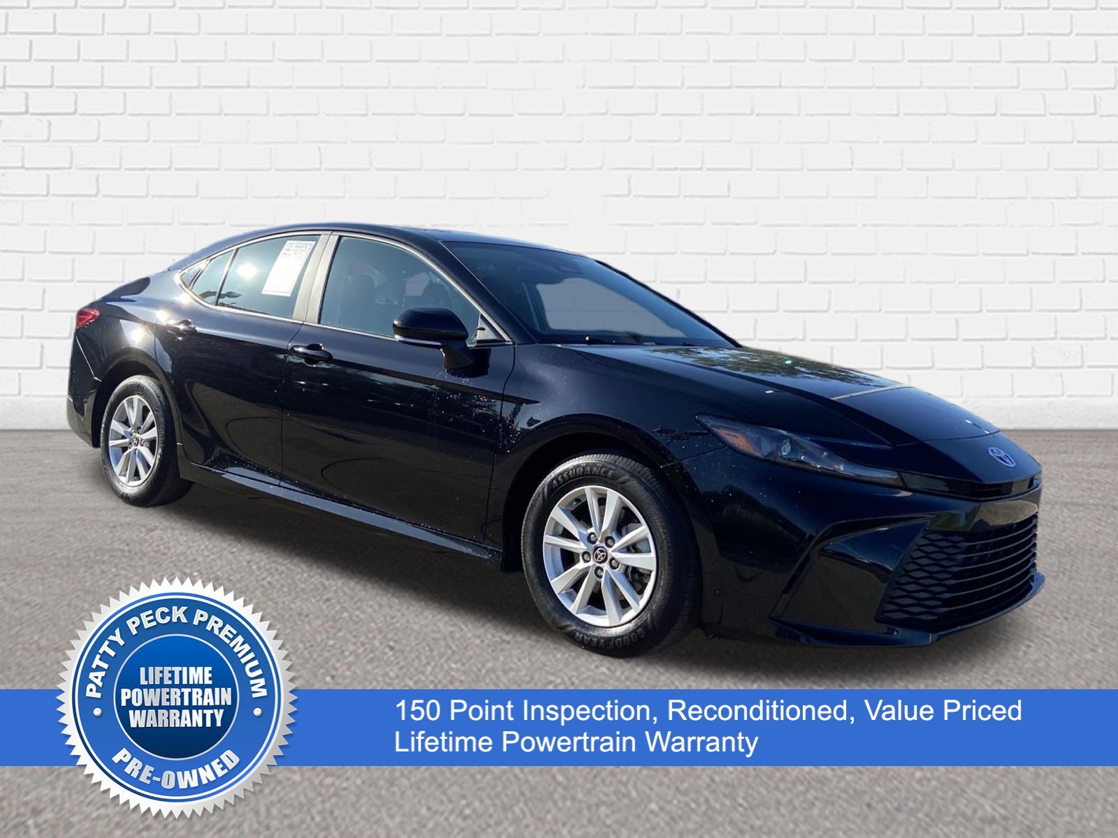 Used 2025 Midnight Black Metallic Toyota LE image 1