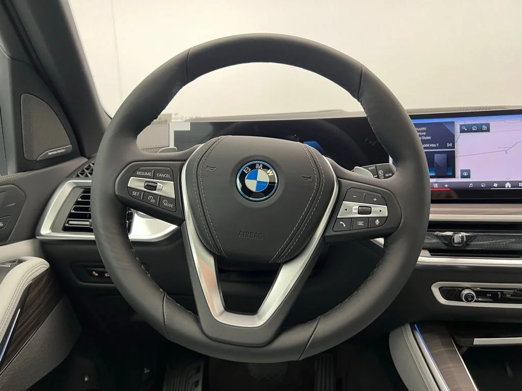 Used 2026 Tanzanite Blue II Metallic BMW xDrive50e image 17