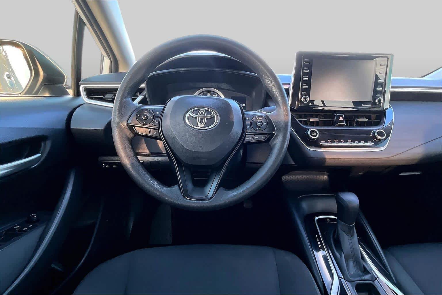 Used 2021 Super White Toyota LE image 6