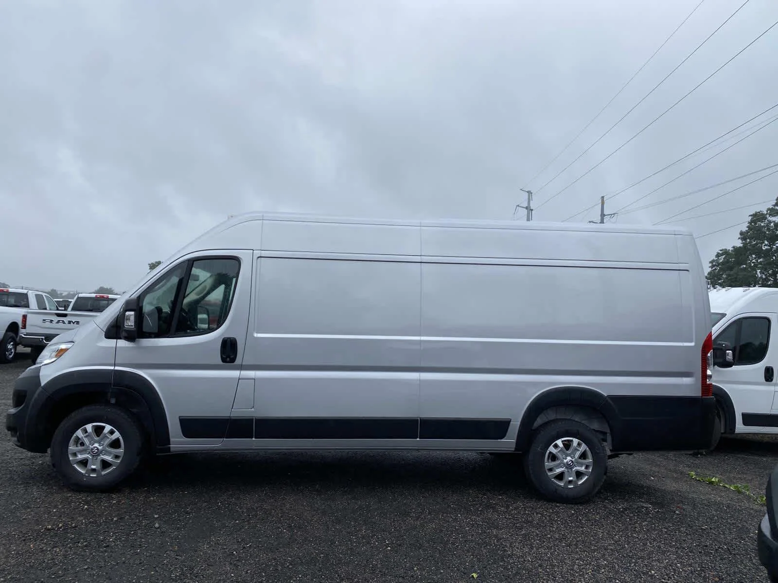 Used 2025 Bright Silver Metallic Clearcoat Ram SLT+ image 8