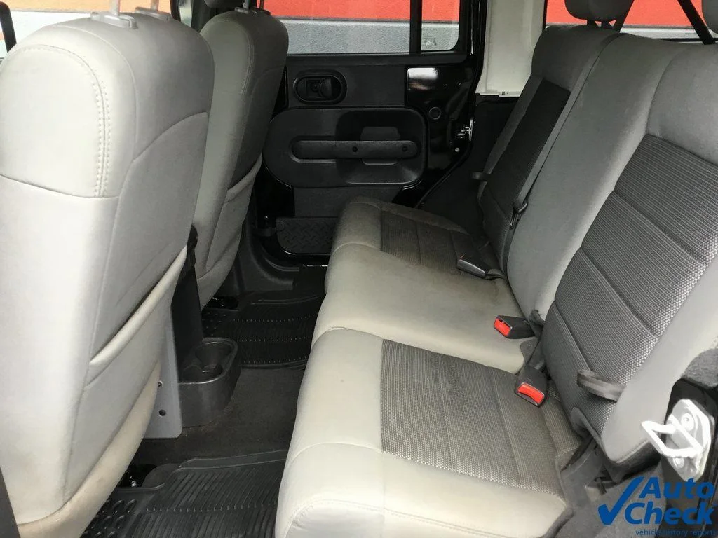 Used 2010 Black Jeep Unlimited Sport image 22