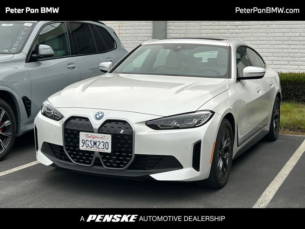 Certified Used 2023 White Metallic BMW eDrive40 image 1