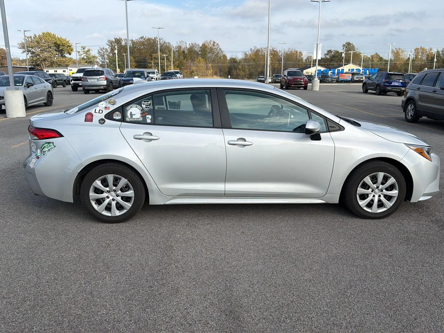Used 2021 Classic Silver Metallic Toyota LE image 2