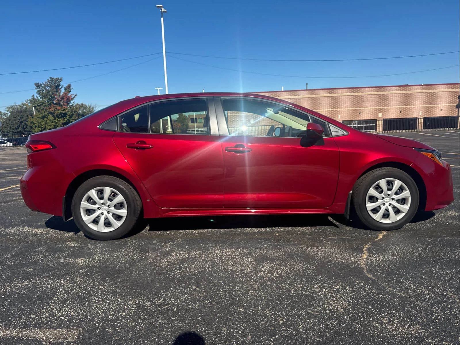 Used 2024 Ruby Flare Pearl Toyota LE image 14