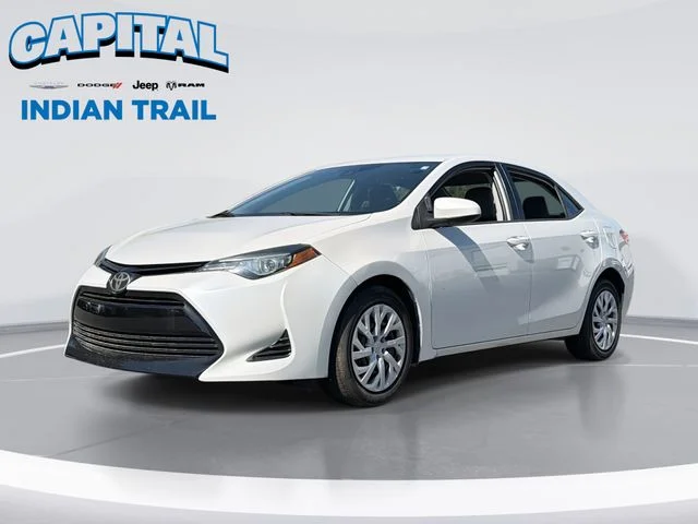 Used 2019 White Toyota LE image 1