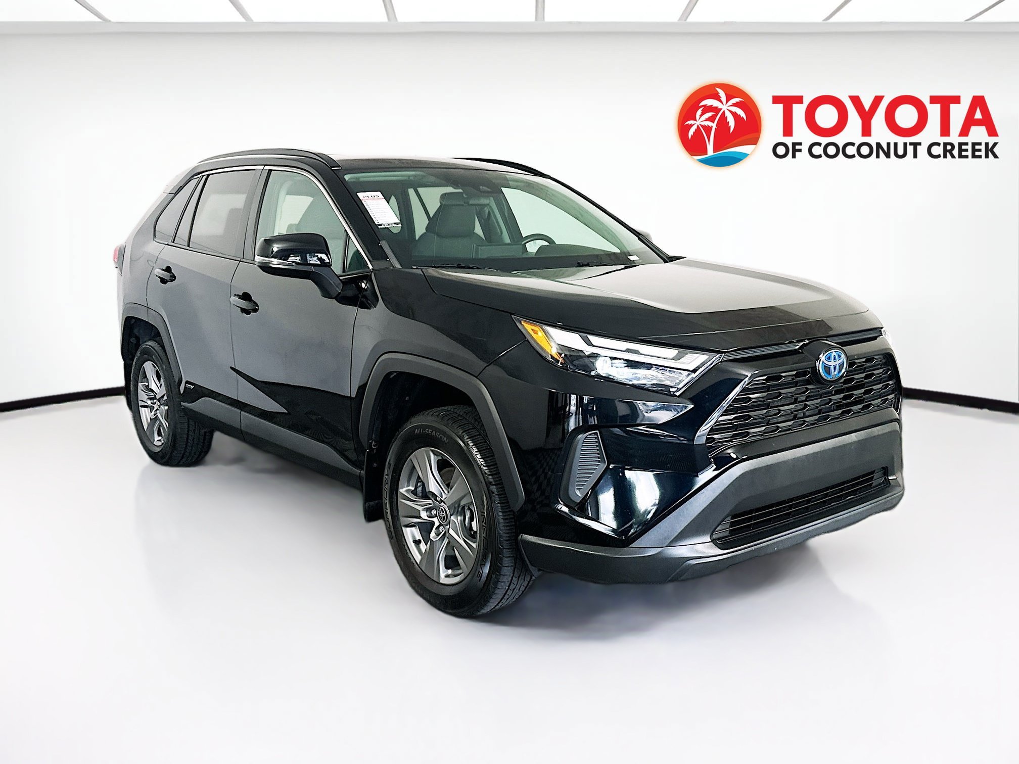 Used 2024 Midnight Black Metallic Toyota Hybrid XLE image 1