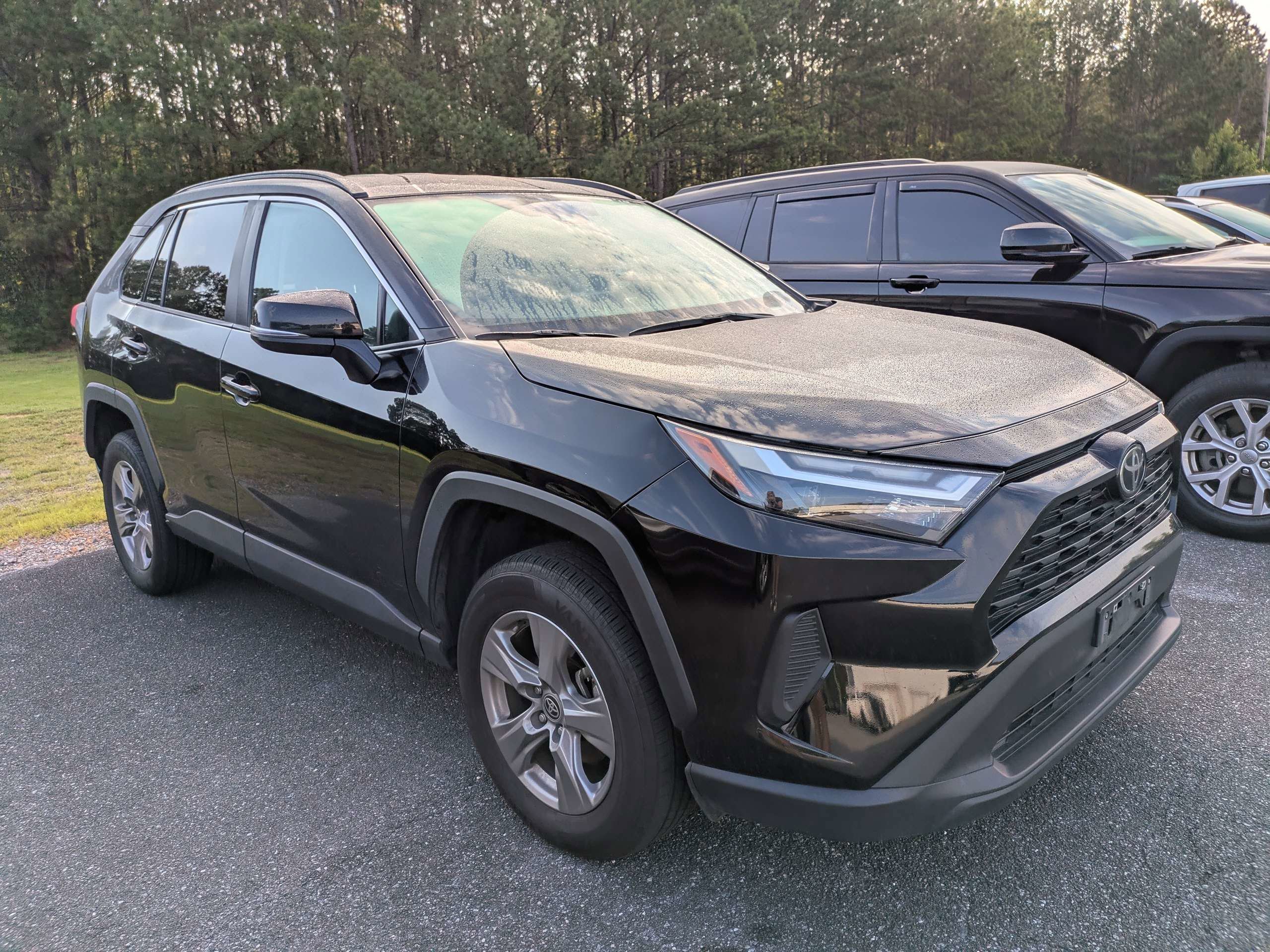 Used 2024 Midnight Black Metallic Toyota XLE image 1