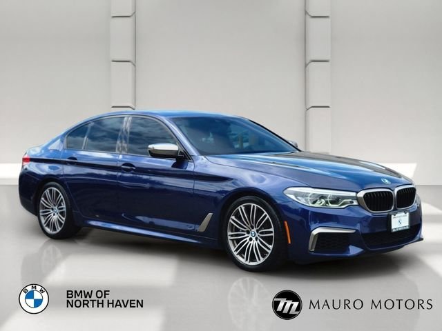 Used 2020 Blue BMW M550i xDrive image 1