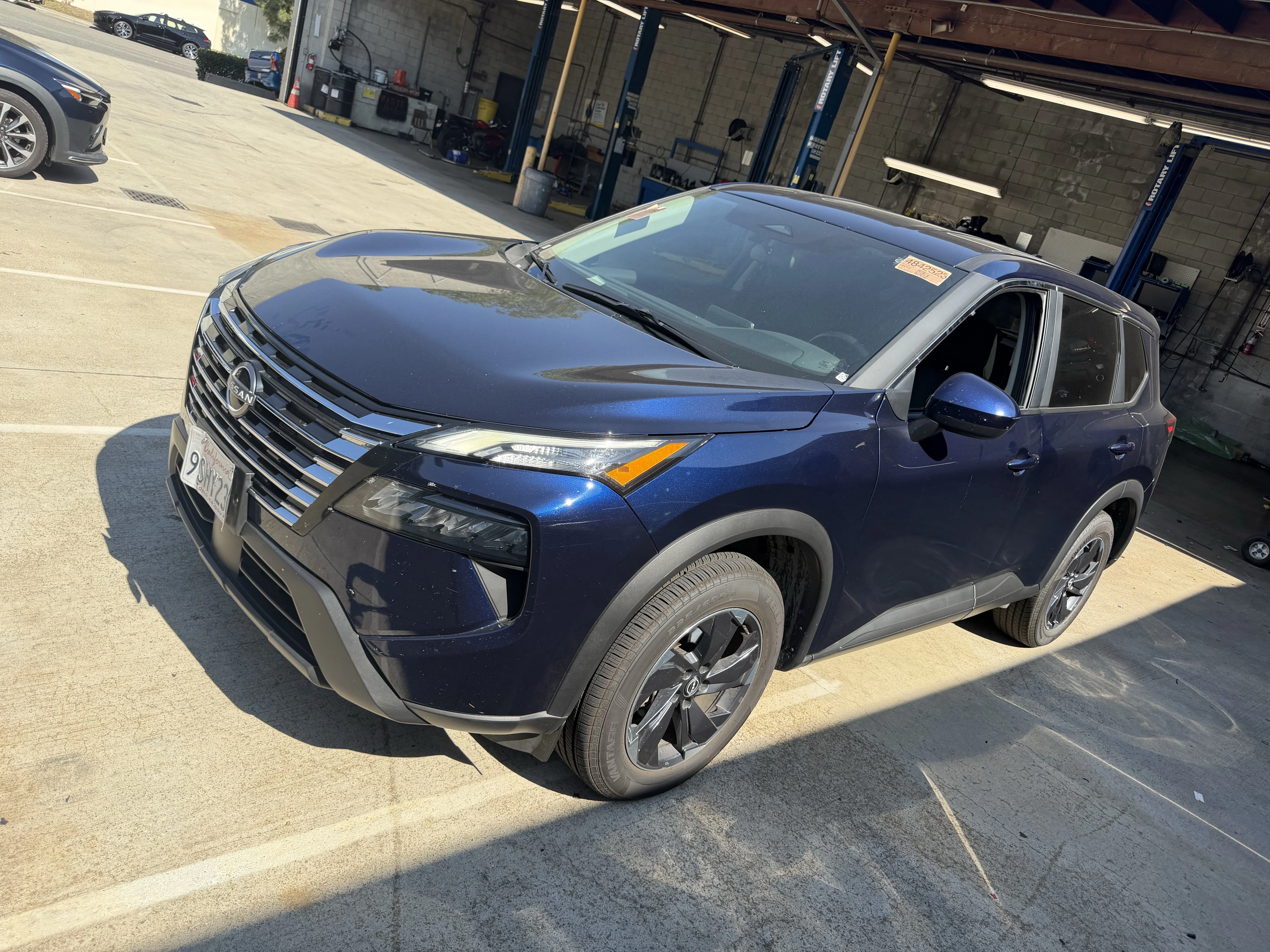 Used 2025 Deep Ocean Blue Pearl Nissan SV image 1