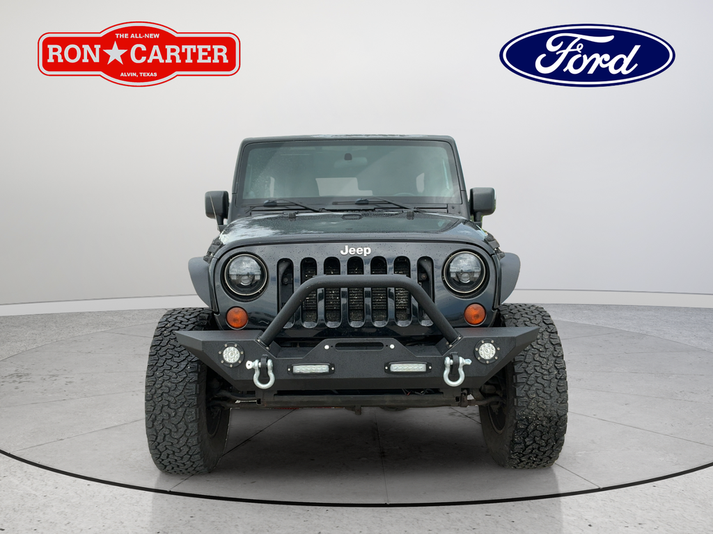 Used 2012 Black Clearcoat Jeep Unlimited Sahara image 2