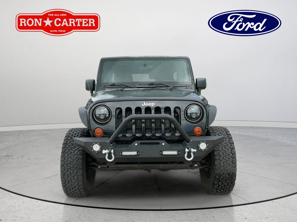 Used 2012 Black Jeep Unlimited Sahara image 2