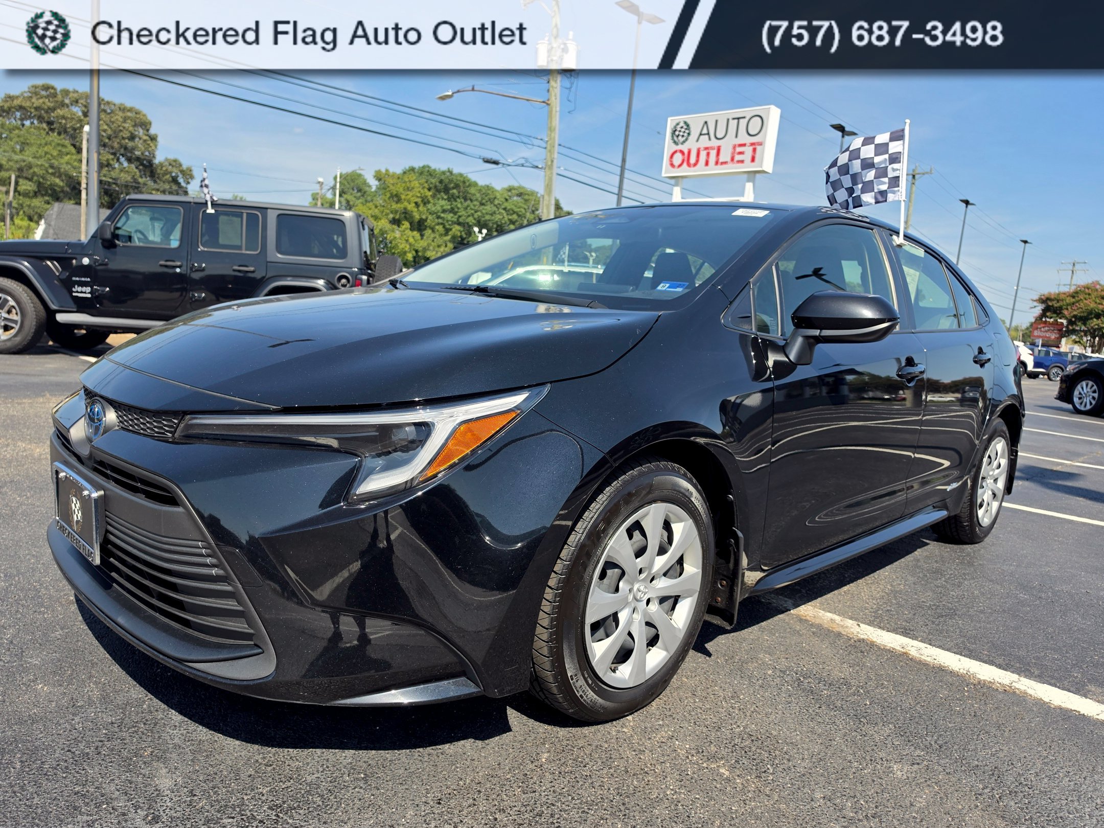 Used 2023 Midnight Black Metallic Toyota LE image 1