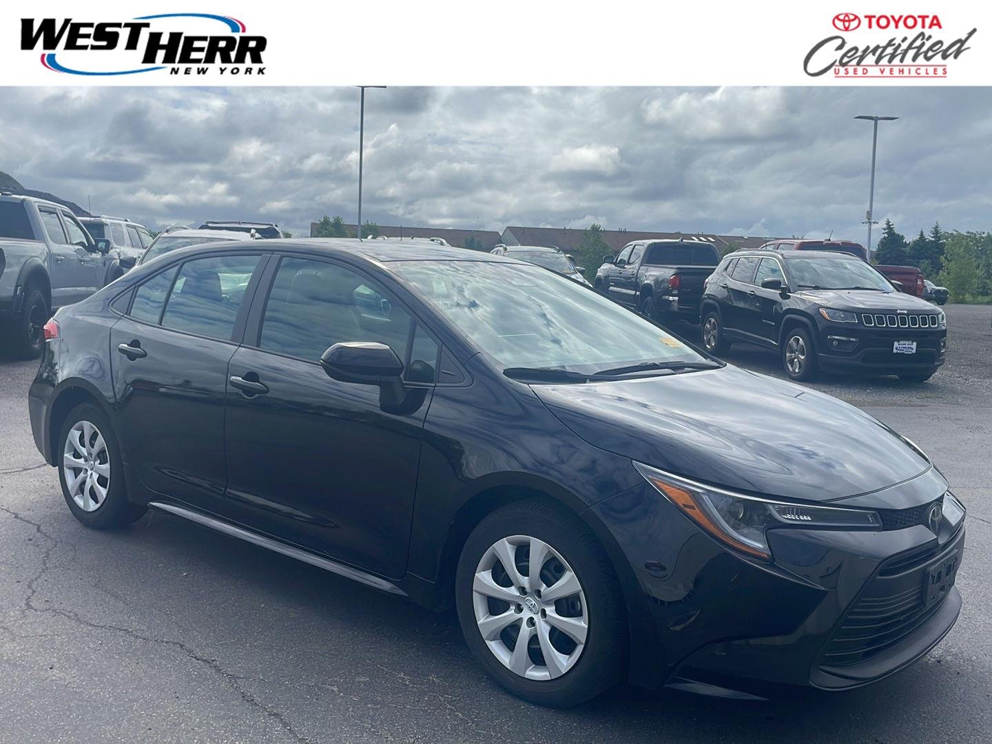 Certified Used 2024 Midnight Black Metallic Toyota LE image 1