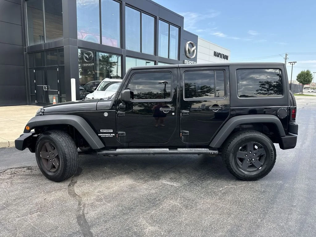 Used 2013 Black Jeep Unlimited Sport image 8