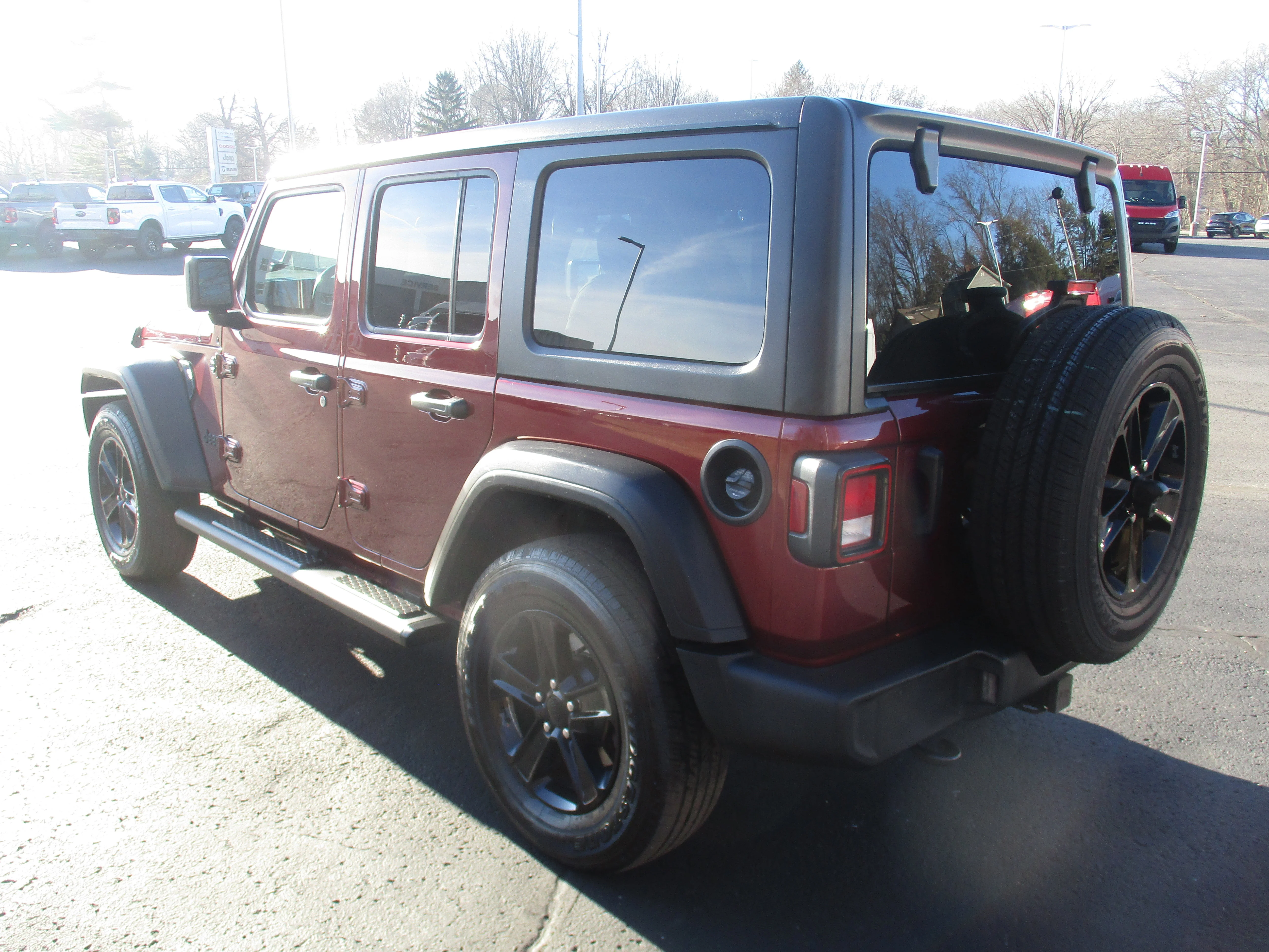 Used 2021 Snazzberry Pearlcoat Jeep Unlimited Sport Altitude image 9