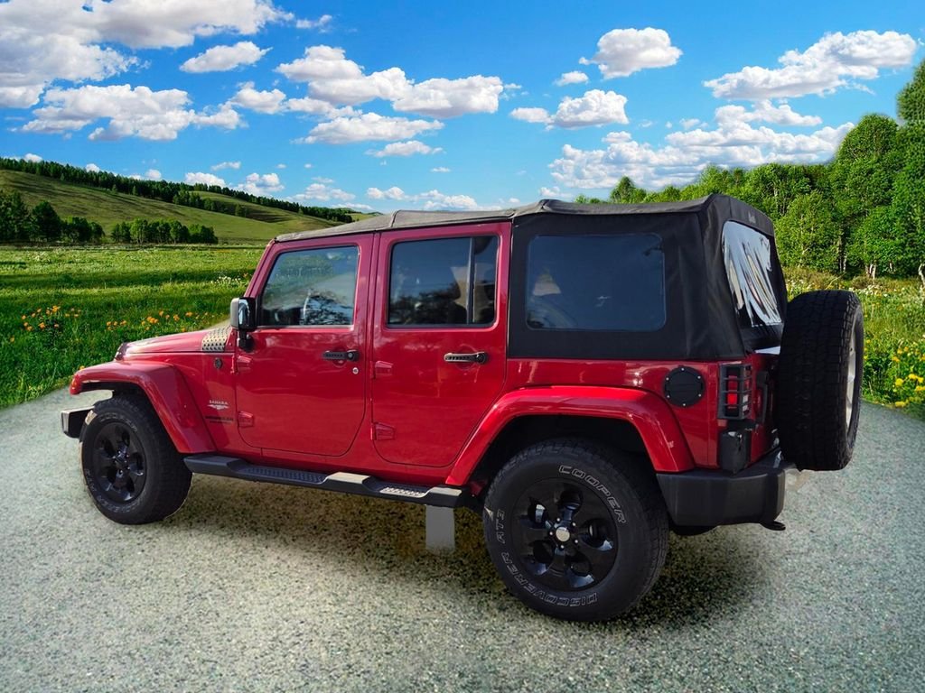 Used 2015 Red Jeep Unlimited Sahara image 4