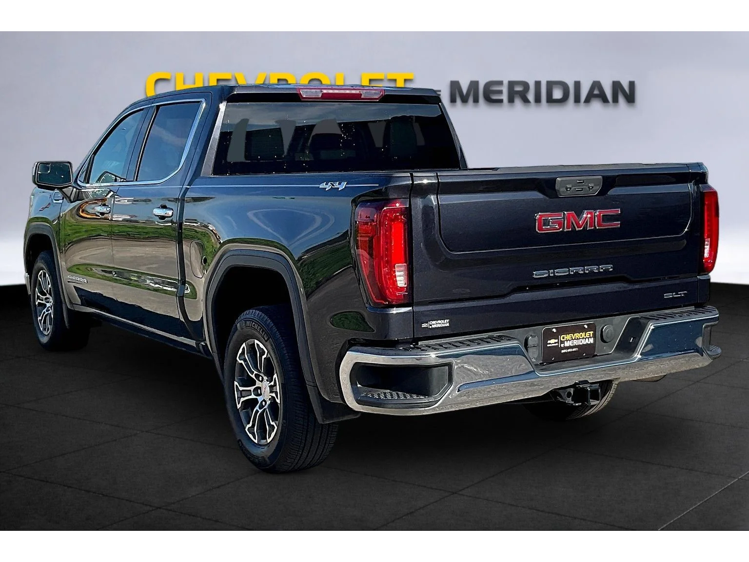 Used 2024 Titanium Rush Metallic GMC SLT image 2