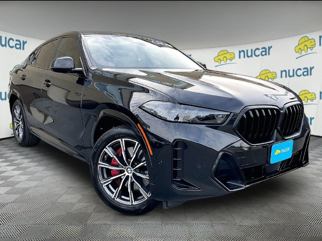 Used 2024 Black BMW xDrive40i image 1