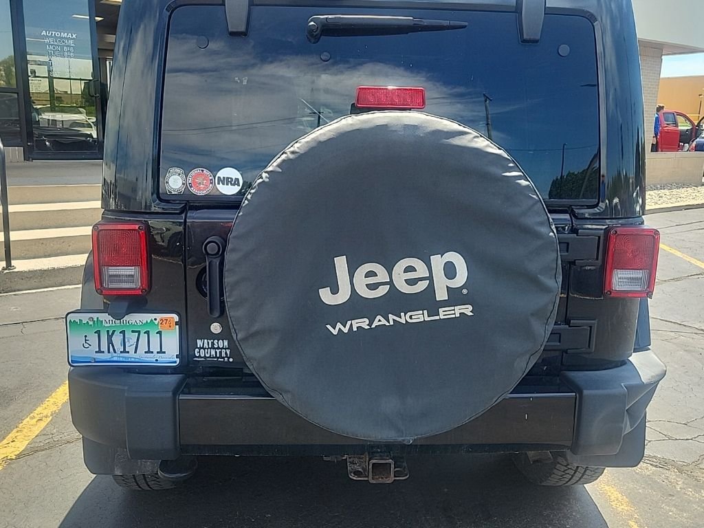 Used 2015 Black Clearcoat Jeep Sahara Altitude image 4