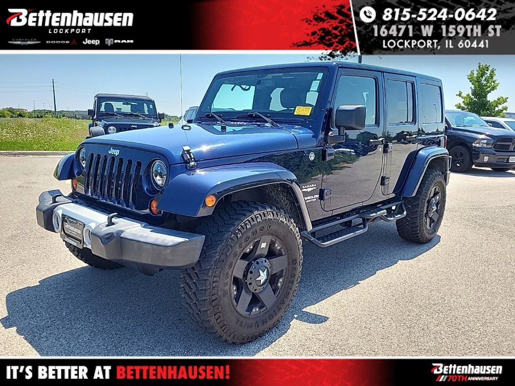Used 2013 Blue Jeep Unlimited Sahara image 1