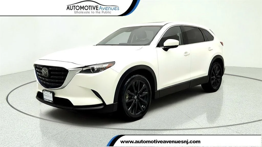 Used 2023 Snowflake White Pearl Mica Mazda Touring Plus AWD image 1